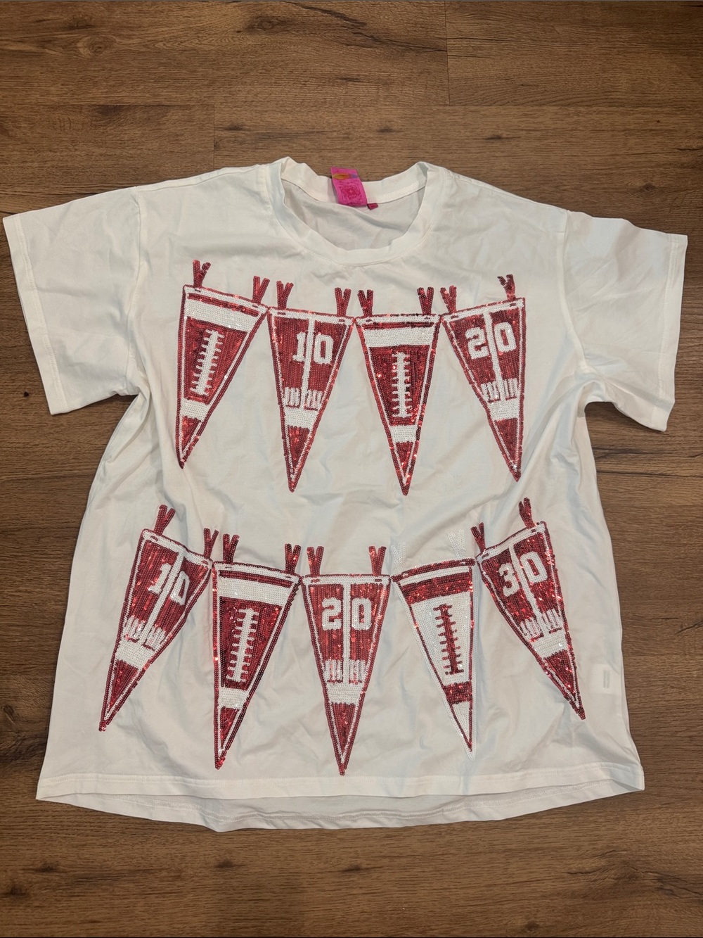 QUEEN OF SPARKLES White Short-Sleeve Tee with Red Pennant Graphic
